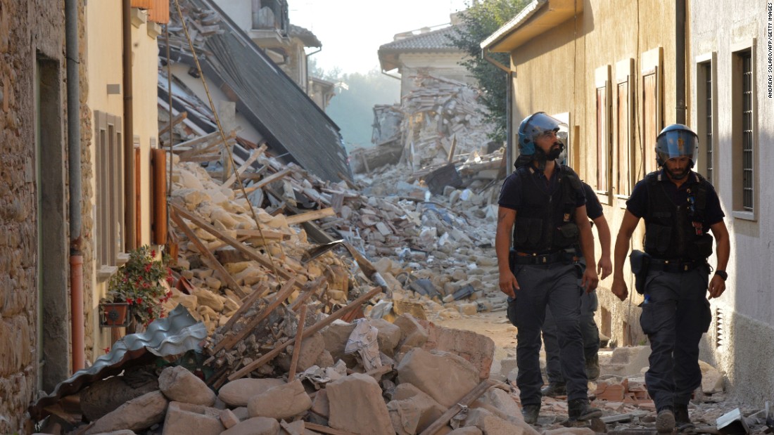 Police inspect rubble and debris in Amatrice, Italy, on August 27.