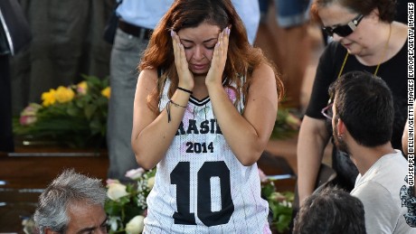 Some of the mourners at a state funeral for Italy&#39;s earthquake victims were clearly in shock as they said goodbye to victims.