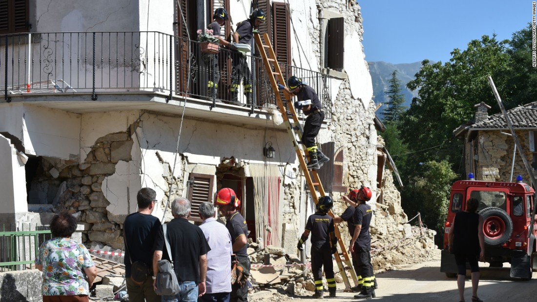 Firefighters help residents recover personal belongings from damaged houses in the village of Rio, Italy, on Sunday, August 28.  A 6.2-magnitude earthquake struck central Italy on Wednesday, killing more than 290 people. The death toll is expected to rise as rescue teams reach remote areas.