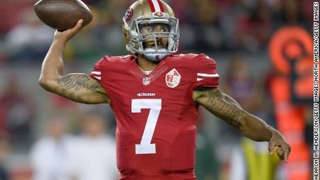 NFL star Colin Kaepernick  sits in protest during national anthem