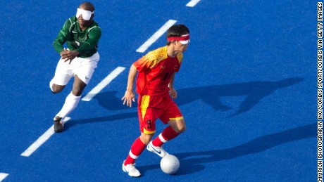 Visually impaired footballers play by locating the ball and each other through sound.