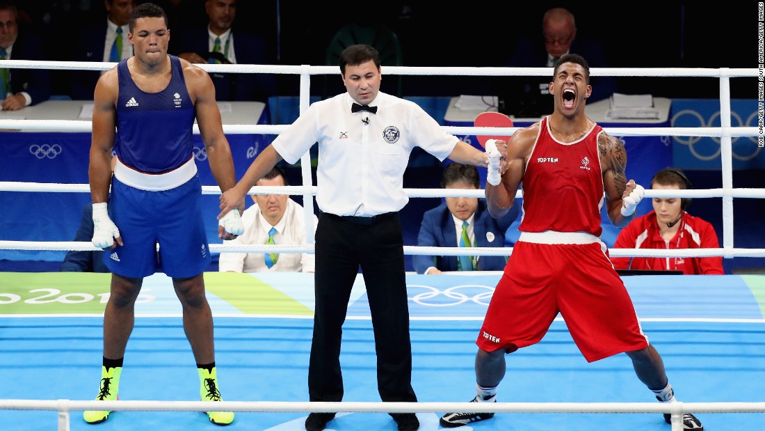 Joyce (L) represented Britain at the Rio 2016 Olympics but lost a controversial super heavyweight gold medal match to Tony Yoka of France. Sid Khan is critical of amateur boxing&#39;s reformed scoring system, along with the removal of headgear and the introduction of professionals into the Olympics.  