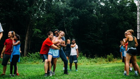 Campers and counselors play the Person-to-Person trust-building exercise at Outward Bound.