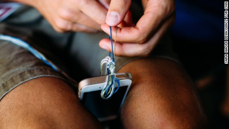 Patrick O&#39;Hagan makes a friendship bracelet using a technique he learned from a fellow camper.