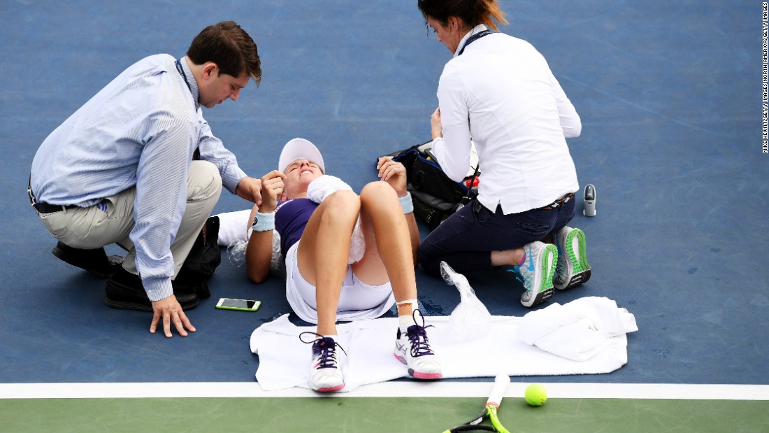 Britain&#39;s Johanna Konta, ranked 14th, needed treatment after dropping to the court. Steamy conditions seemingly took their toll but Konta ended up beating Tsvetana Pironkova 6-2 5-7 6-2.