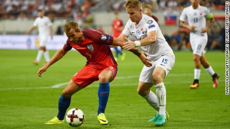 Harry Kane of England holds off Tomas Hubocan of Slovakia during the World Cup Group F qualifying match.