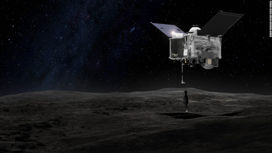 This drawing shows an artist&#39;s concept of what it will look like when the OSIRIS-REx spacecraft briefly touches asteroid Bennu with its robot arm to grab a sample of the asteroid.
