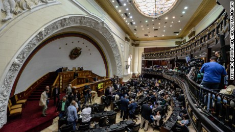 Venezuelan deputies get ready to begin an ordinary session at the National Assembly in Caracas on August 4, 2016. / AFP / FEDERICO PARRA        (Photo credit should read FEDERICO PARRA/AFP/Getty Images)