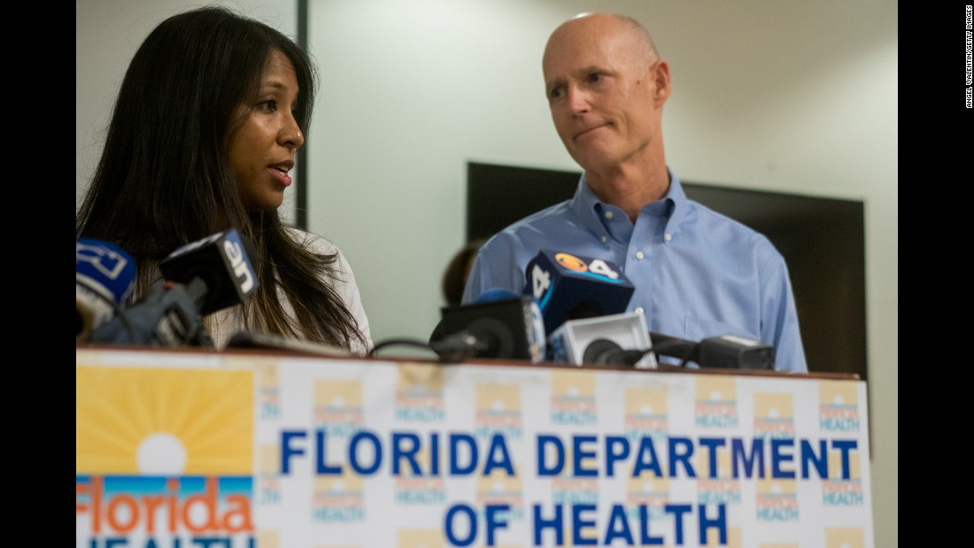 Florida Gov. Rick Scott and Florida Surgeon General Dr. Celeste Philip address the media gathered at the Miami-Dade County Department of Health as they announce five cases of Zika in a 1.5 mile area of Miami Beach on Friday, August 19, in Miami, Florida. 