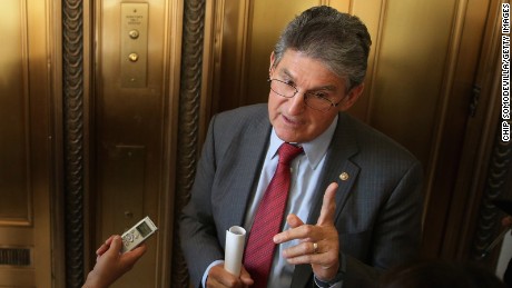 Sen. Joe Manchin (R-WV) talks to reporters after attending a Senate bipartisan lunch in the Russell Senate Office Building on Capitol Hill February 4, 2015 in Washington, DC. 