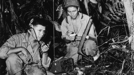 The Navajo Code Talkers shown here were Cpl. Henry Bake, Jr. and PFC George H. Kirk, as they worked in Bougainville, in the South Pacific, circa 1943.