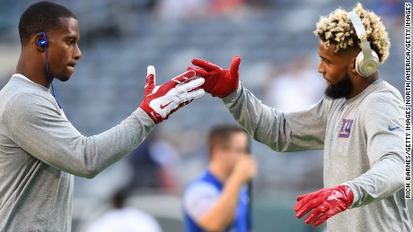 Wide receivers Victor Cruz (L) and Odell Beckham of the New York Giants engaged in a choreographed pregame handshake, one of many rituals which NFL players will embrace throughout the season.