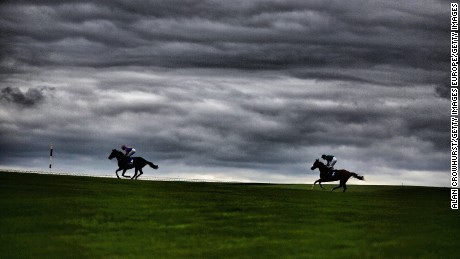 Runners make their way across the centre of the track at Curragh Racecourse.
