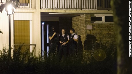 Police appear outside a building Thursday in Boussy-Saint-Antoine  after the arrest of female suspects.