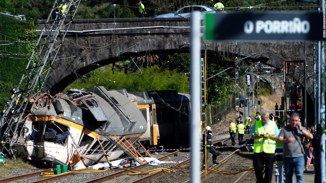 First responders work at the scene of a train derailment near O Porrino station in northwestern Spain&#39;s Galicia region on Friday, September 9. At least four people were killed and nearly 50 others injured in the crash, authorities said.