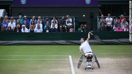 Reid serves against Swede Stefan Olsson during the Wimbledon men&#39;s wheelchair singles final.