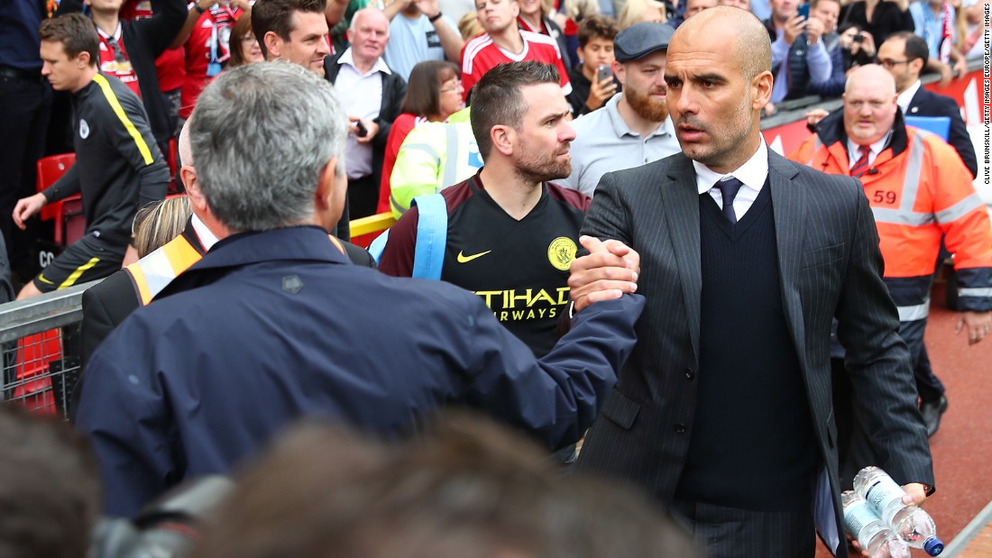  Manchester United manager Jose Mourinho shakes hands with  Manchester City manager Pep Guardiola prior to the Premier League match between Manchester United and Manchester City at Old Trafford on September 10, 2016 in Manchester, England.  