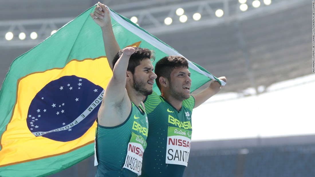 Yohansson Nascimento (L) celebrates his bronze medal with gold medalist Petrucio Ferreira dos Santos after the T47 100m final meter. They were just two of four sprint medalists the host nation got to celebrate Sunday.