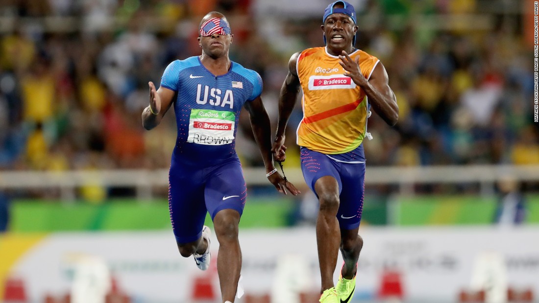 David Brown on his way to winning T11 gold with his guide Jerome Avery and becoming the first full blind man in history to run sub-11 seconds. Brown is also a talented musician and play drums, piano and tenor saxophone.