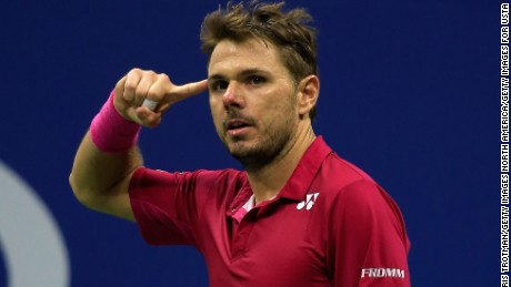 Stan Wawrinka points to his temple on the way to victory over Novak Djokovic  in the men&#39;s finals of  the 2016 US Open in New York. 
