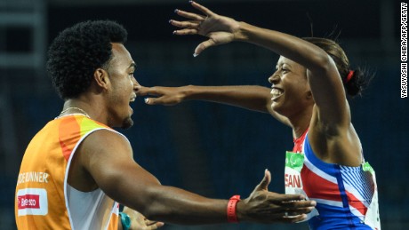 Cuba&#39;s Omara Durand celebrates with her guide, Yuniol Kindelan, after winning the women&#39;s T12 100-meter.