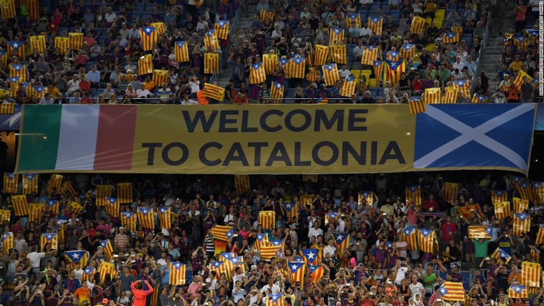 Barcelona fans hold up Catalan flags during the match against Celtic. The flag, known locally as the &quot;Estelada,&quot; has in recent years become a symbol of the independence movement within Catalonia. UEFA outlaws the use of objects that transmit political messages. 