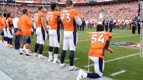 Brandon Marshall of the Denver Broncos takes a knee during the National Anthem before a game September 8.