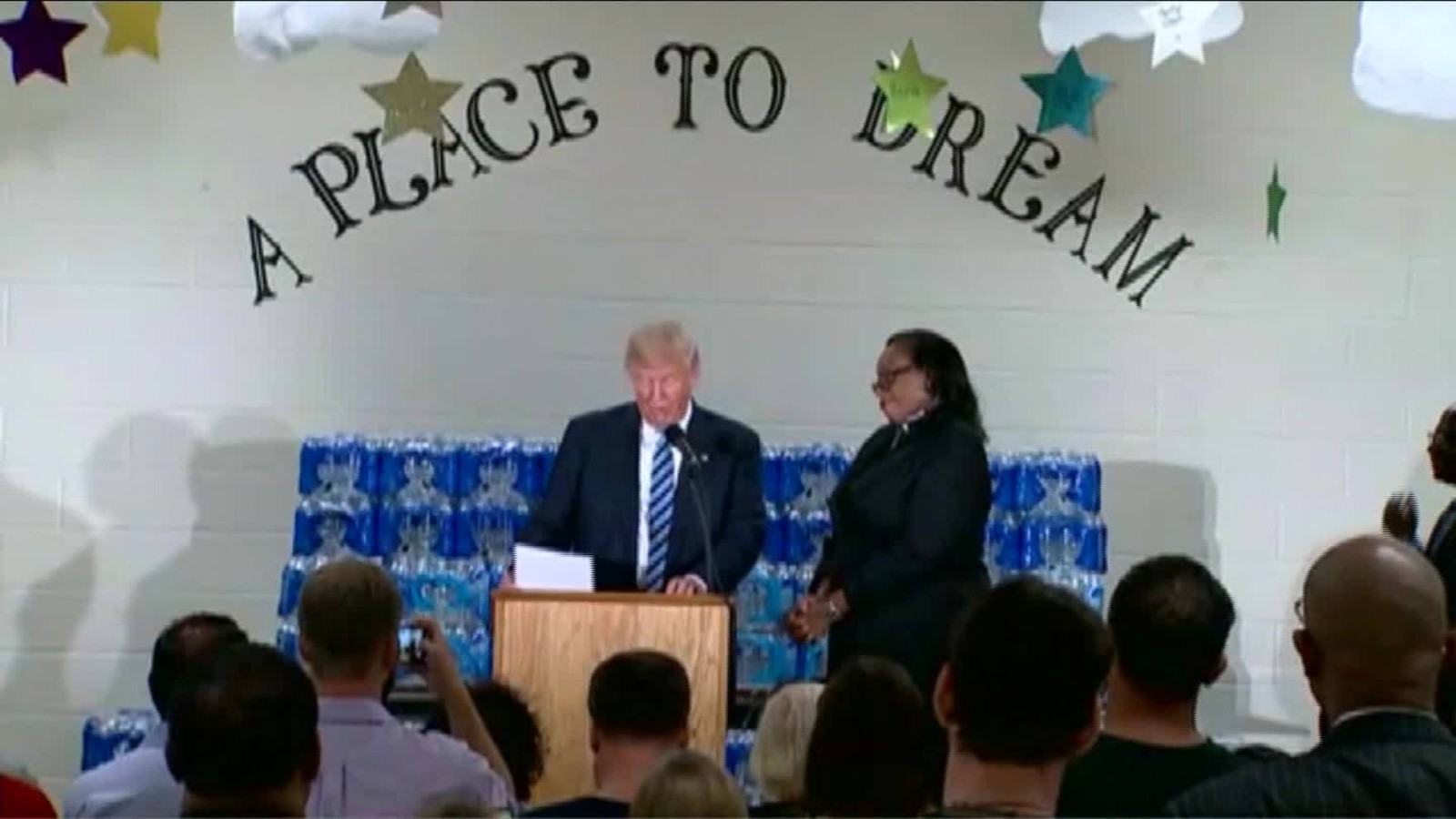 Trump interrupted by pastor at church in Flint, Michigan - CNN Video