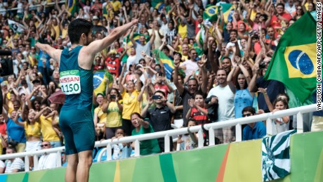 Brazil&#39;s Yohansson Nascimento takes the plaudits of the crowd after the 100m final.