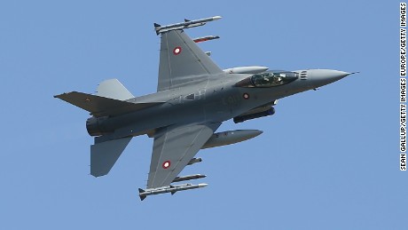 HELME, ESTONIA - MAY 19:  An F-16 fighter plane of the Royal Danish Air Force simulates an attack during a demonstration while participating in the NATO &quot;Spring Storm&quot; military exercises on May 19, 2014 near Helme, Estonia. The annual exercises, in which Estonian, Latvian, Lithuainian, U.S., British, Polish, Belgian and Danish troops are participating, are underway as sporadic fighting between Ukrainian and pro-Russian separatists continues in eastern Ukraine.  (Photo by Sean Gallup/Getty Images)