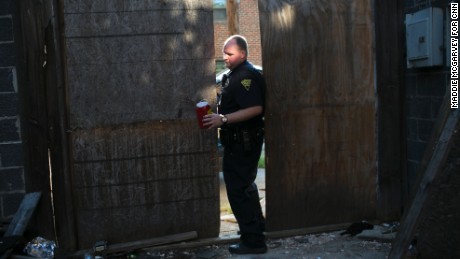 Patrolman Jacob Felix collects dirty needles at Marcum Terrace. Two officers, three firefighters and two EMS workers respond to every overdose.