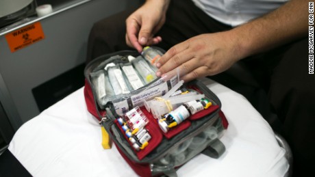 Capt. Derrick Ray takes naloxone out of a first-responder&#39;s kit. Many residents carry the opiate blocker in case they encounter an overdose.