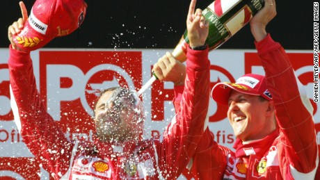 Massa is sprayed by the great Michael Schumacher as the Brazilian celebrates his first grand prix win. 