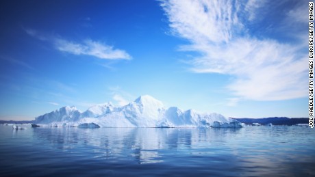 ILULISSAT, GREENLAND - JULY 20:  An iceberg floats through the water on July 20, 2013 in Ilulissat, Greenland. As Greenlanders adapt to the changing climate and go on with their lives, researchers from the National Science Foundation and other organizations are studying the phenomena of the melting glaciers and its long-term ramifications for the rest of the world. In recent years, sea level rise in places such as Miami Beach has led to increased street flooding and prompted leaders such as New York City Mayor Michael Bloomberg to propose a $19.5 billion plan to boost the citys capacity to withstand future extreme weather events by, among other things, devising mechanisms to withstand flooding.  (Photo by Joe Raedle/Getty Images) (Photo by Joe Raedle/Getty Images)