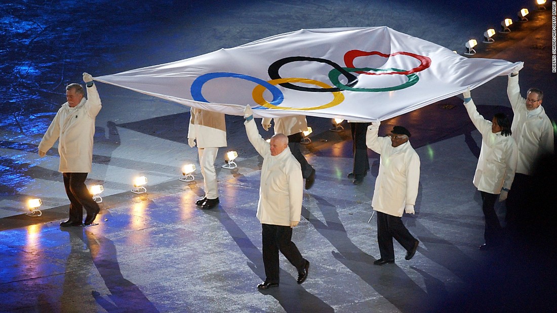 Tutu and other dignitaries escort the Olympic flag during the opening ceremony of the 2002 Winter Olympics in Salt Lake City.