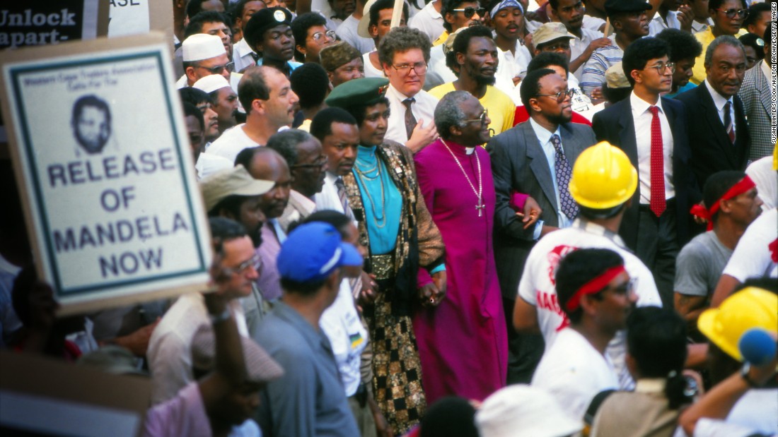 Tutu and Winnie Mandela march in Cape Town to protest the continued imprisonment of anti-apartheid leader Nelson Mandela in February 1990. Later that day, South African President F.W. de Klerk would announce Mandela&#39;s release.
