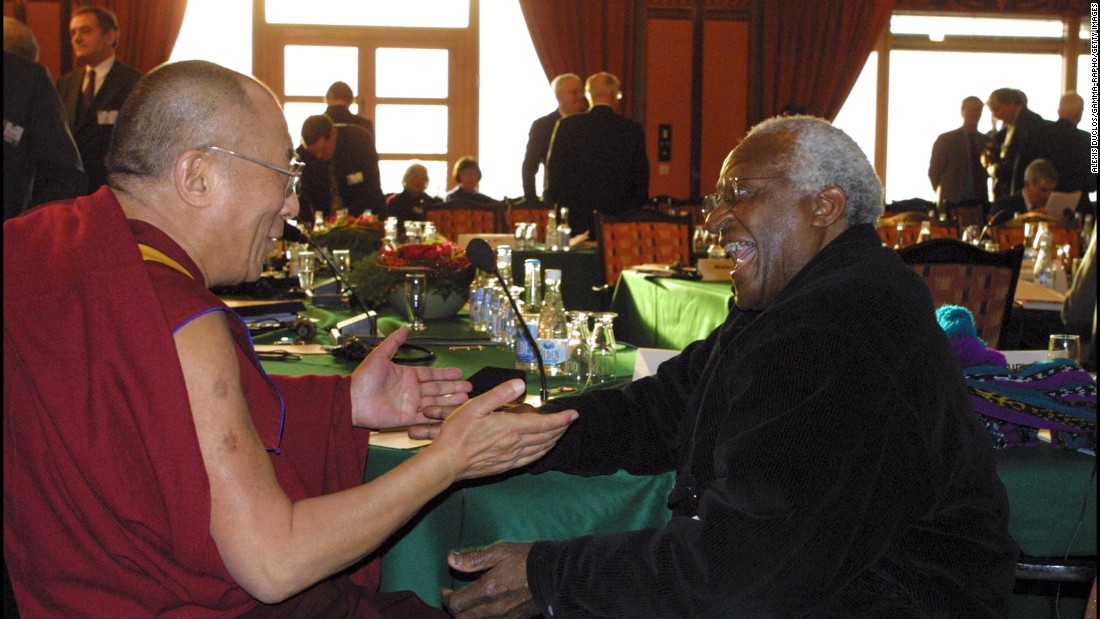 Tutu and the Dalai Lama attend the Nobel Peace Prize Centennial Symposium in 2001.