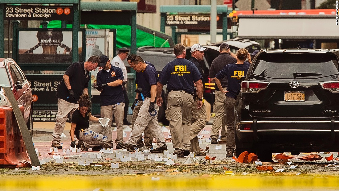 FBI agents review the scene of the explosion on Sunday morning. 