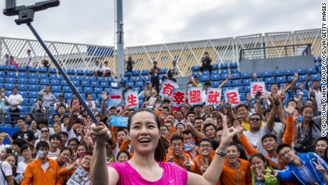Li Na takes a selfie with fans during last year&#39;s Wuhan Open in her hometown in central Hubei province..  