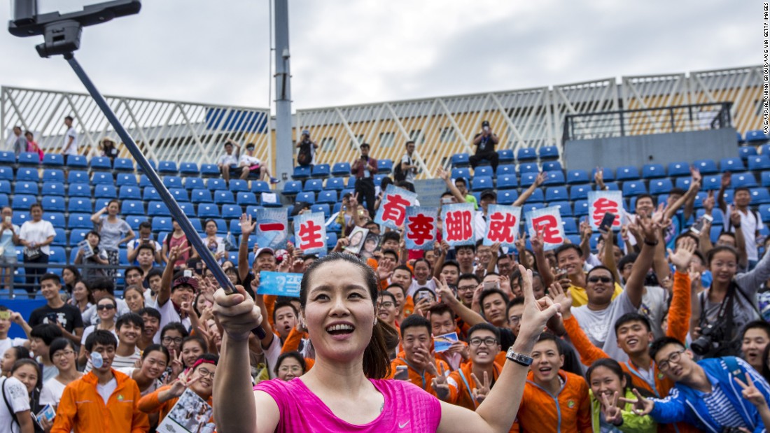 A superstar in China, Li became a global ambassador for her hometown event in May of this year. Here she takes a selfie with fans during a tennis masterclass last year. 