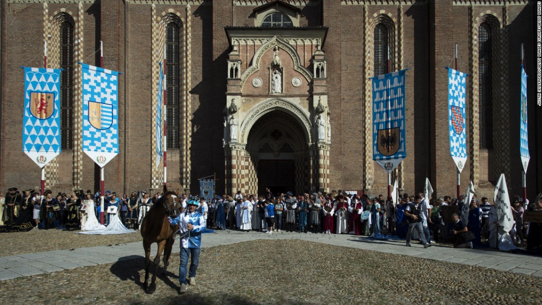 A horse and jockey are blessed outside Asti Cathedral ahead of the 2016 Palio on September 18.
