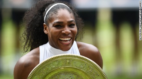 TOPSHOT - US player Serena Williams poses with the winner&#39;s trophy, the Venus Rosewater Dish, after her women&#39;s singles final victory over Germany&#39;s Angelique Kerber on the thirteenth day of the 2016 Wimbledon Championships at The All England Lawn Tennis Club in Wimbledon, southwest London, on July 9, 2016. / AFP / GLYN KIRK / RESTRICTED TO EDITORIAL USE        (Photo credit should read GLYN KIRK/AFP/Getty Images)