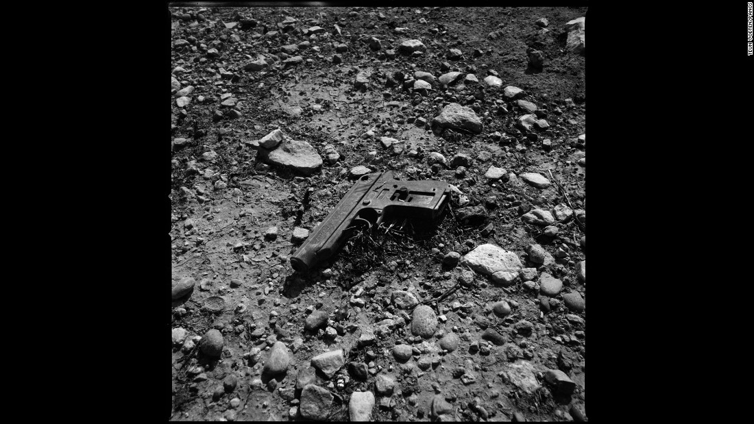 A discarded pistol lies on the ground in Sinjar.