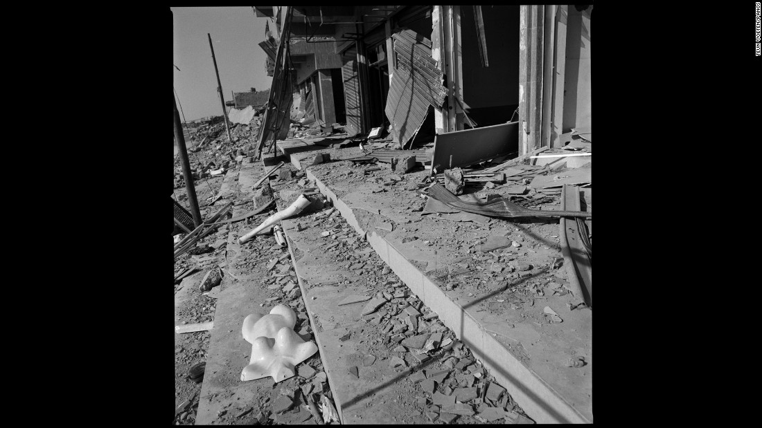 Part of a mannequin lies outside destroyed shops in Sinjar.