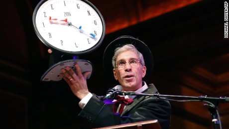 Master of Ceremonies Marc Abrahams holds up the 2016 Ig Nobel award during ceremonies at Harvard University in Cambridge, Mass., Thursday, Sept. 22, 2016. 