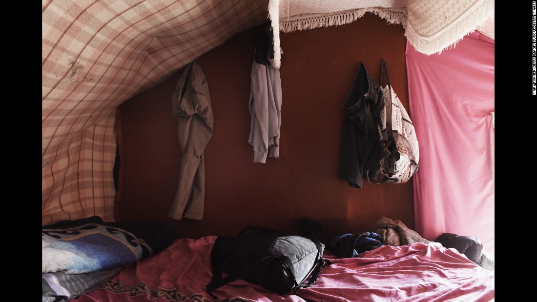 The home of Sami, a refugee living in the &quot;The Jungle,&quot; is pictured in August 2015. Sami, who has lived in the camp for two months, said: &quot;We made this house from blankets and wood and then covered it in plastic to keep the rain out. It rains often in France. I think it will rain often when I am in England, too.&quot;