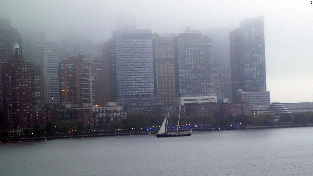 They came into port early in the morning, and the mist covered the tops of Manhattan&#39;s skyscrapers.