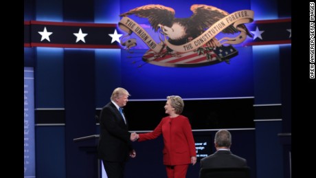 (L-R) Republican presidential nominee Donald Trump and Democratic presidential nominee Hillary Clinton shake hands prior to the start of the Presidential Debate at Hofstra University on September 26, 2016 in Hempstead, New York.  The first of four debates for the 2016 Election, three Presidential and one Vice Presidential, is moderated by NBC&#39;s Lester Holt.