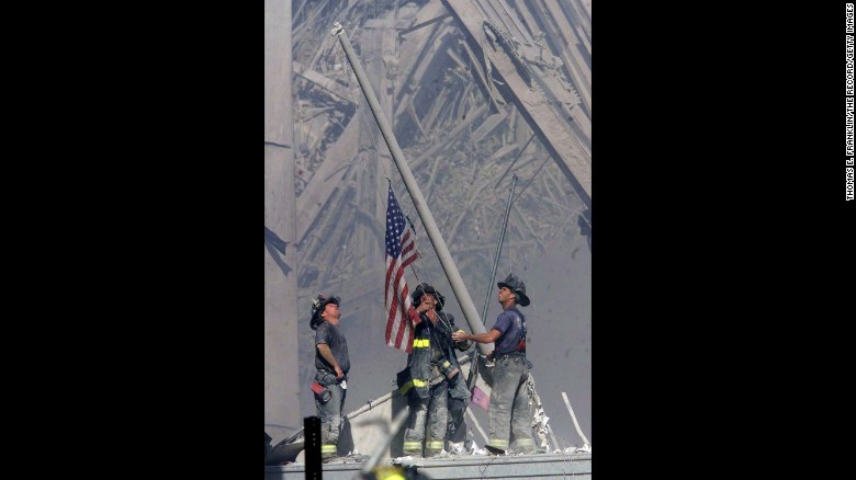 Firefighters George Johnson, Dan McWilliams and Billy Eisengrein raise a flag at ground zero in New York after the terror attacks on September 11, 2001. The scene was immortalized by photographer Thomas E. Franklin. The image has been widely reproduced in the decade since it was first published. &lt;a href=&quot;http://www.cnn.com/2013/09/01/world/gallery/iconic-images/index.html&quot;&gt;View 25 of history&#39;s most iconic photographs.&lt;/a&gt;