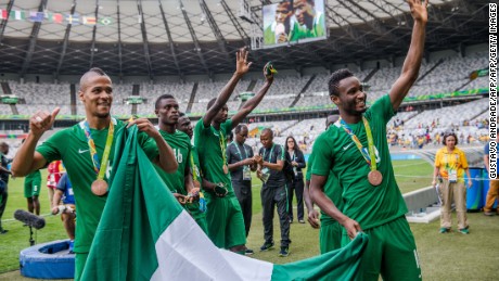 Happier times: Nigeria&#39;s players William Ekong (L) and John Obi Mikel (R) celebrate with bronze medals at the Rio 2016 Olympics. A Japanese fan gifted the cash-strapped team $390,000 after the match. 